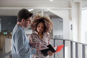 Colleagues looking at ideas together