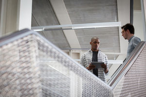 Colleagues talking on a staircase