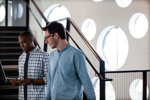 Colleagues talking on a staircase