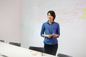 Businesswoman standing in front of white board 
