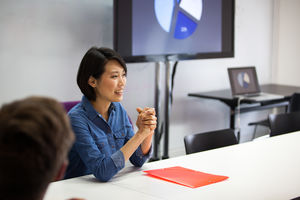 Businesswoman smiling in a meeting