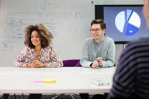 Colleagues listening in a meeting