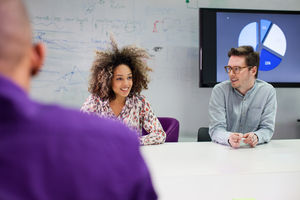 Colleagues listening in a meeting