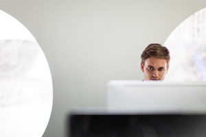 Businessman working on a desktop computer