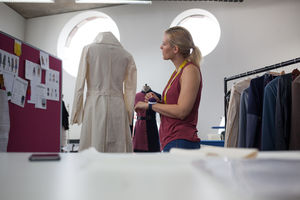 Fashion designer working on garment