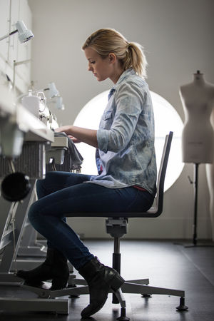 Fashion student working on a sewing machine