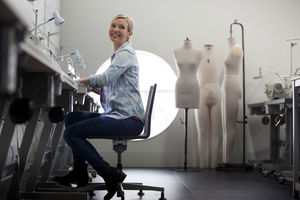 Fashion student working on a sewing machine