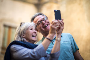 Senior couple on vacation taking a selfie or on video call