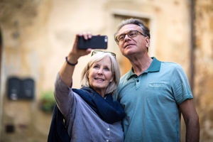 Senior couple on vacation taking a photo
