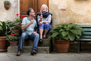 Senior couple eating gelato on vacation