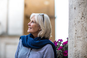 Senior woman on vacation looking at a tourist site