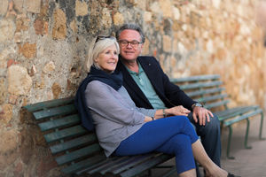 Senior couple sitting on bench relaxing