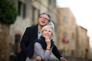 Senior couple on vacation looking at a tourist site