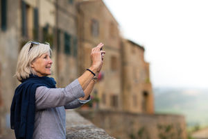 Senior woman on vacation taking a photo