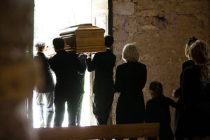 Family following coffin from church