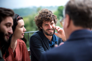 Family talking together at a meal