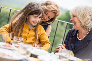 Three generations of women at a family meal
