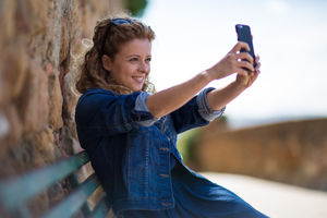 Young adult female taking a selfie on vacation