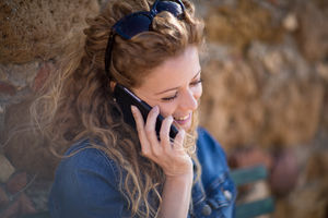 Young adult female talking on phone