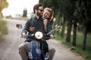 Young couple on motorbike together