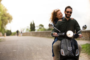 Young couple on motorbike together