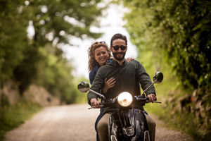 Young couple on motorbike together