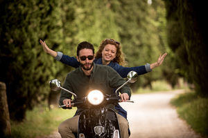 Young couple having fun on motorbike together