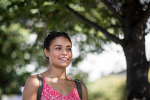 Young adult female walking outdoors