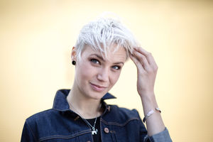 Young adult with hands in hair