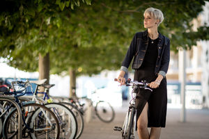 Young adult commuting on bike