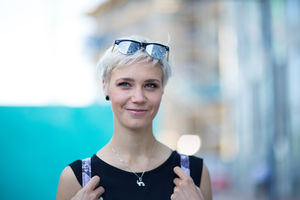 Young adult walking down street in a city