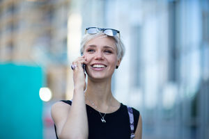 Young adult commuting and using smartphone