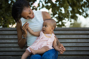 Mum playing with baby girl
