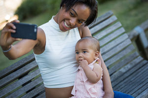Mum taking selfie with baby girl