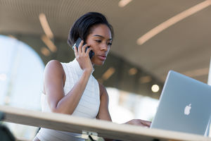 Businesswoman working in café