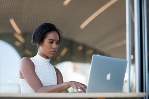 Businesswoman working in café