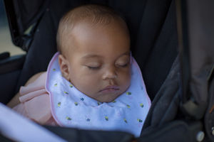 Baby asleep in pushchair