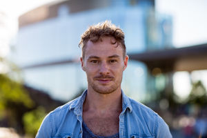 Portrait young adult walking down street