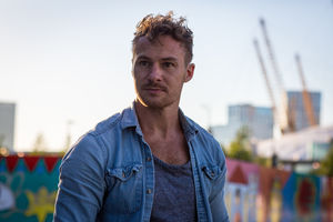 Young adult walking down street 