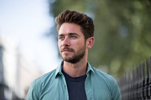 Young adult walking down street 