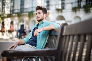 Tourist sitting on bench in London