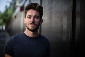 Young adult walking down street
