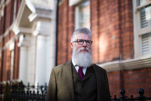 Senior male walking down street