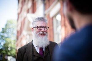 Senior male meeting friend