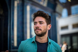 Young adult standing outside London pub