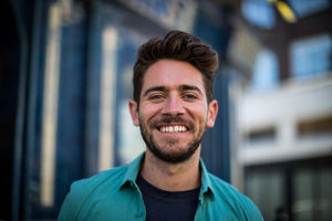Young adult standing outside London pub