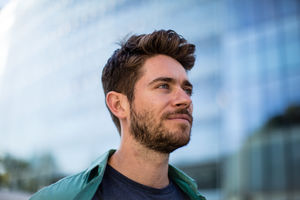 Young adult walking down street