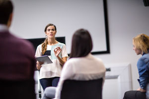Female executive leading a  training conference
