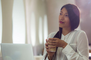 Businesswoman looking out of window 