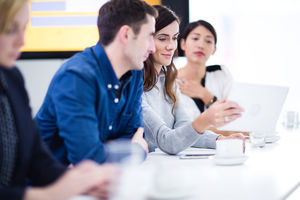Colleagues in a business meeting using technology